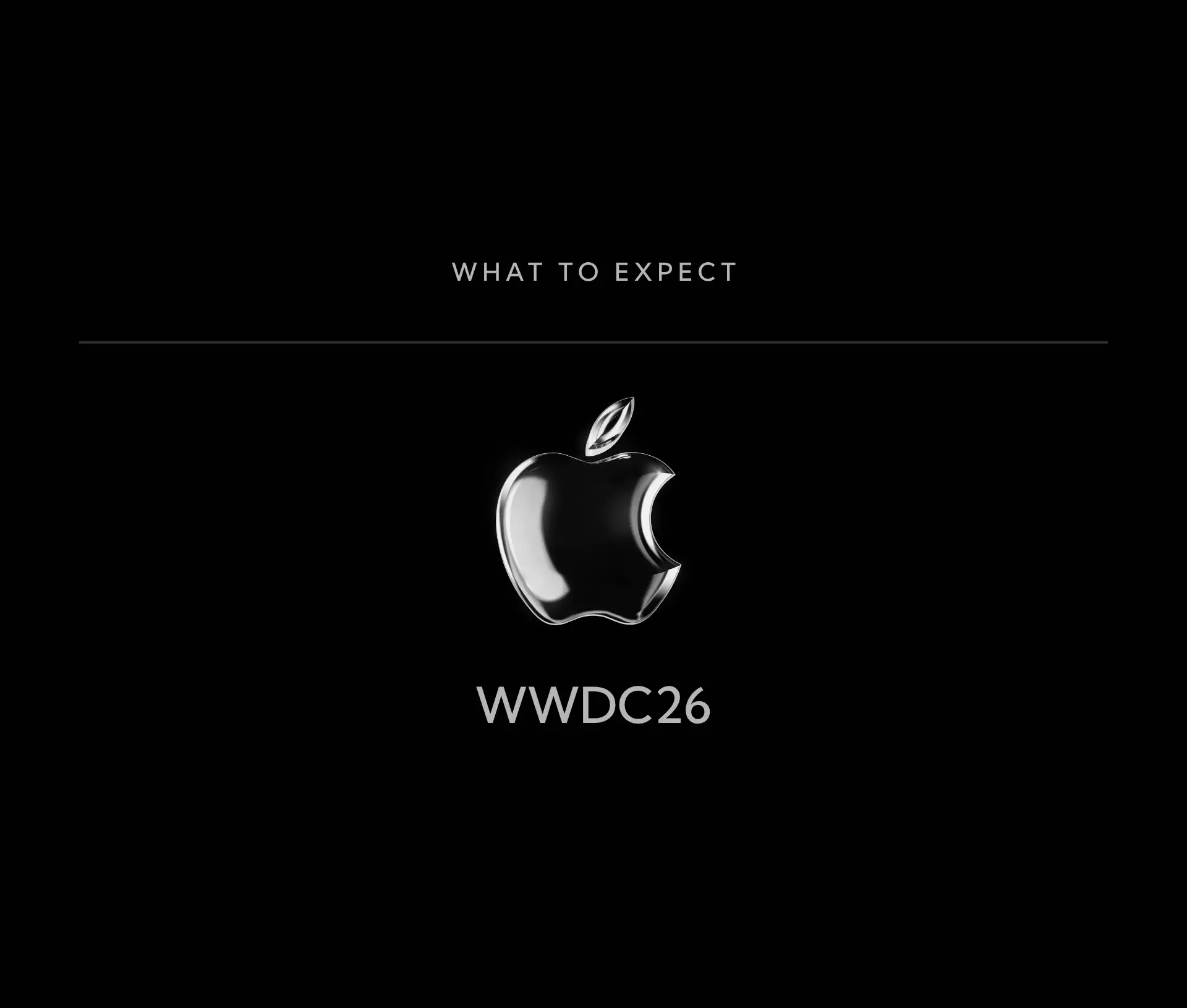 Black background with a shiny silver Apple logo centred. Above the logo, text reads 